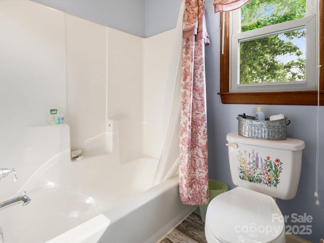 2981 Heath Peak Rd, Waynesville, NC 28785 - full bath featuring shower / bath combo with shower curtain and wood finished floors