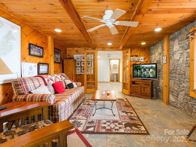 2981 Heath Peak Rd, Waynesville, NC 28785 - living area featuring a wooden ceiling with exposed beams, wooden walls, stone finish flooring, ceiling fan, and recessed lighting