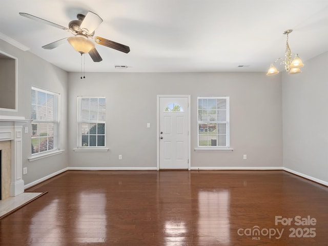 10446 Trolley Run Dr, Cornelius, NC 28031 - unfurnished living room with wood finished floors, a premium fireplace, a chandelier, and ceiling fan