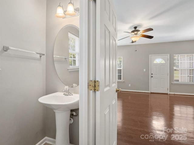 10446 Trolley Run Dr, Cornelius, NC 28031 - bathroom featuring ceiling fan and wood finished floors