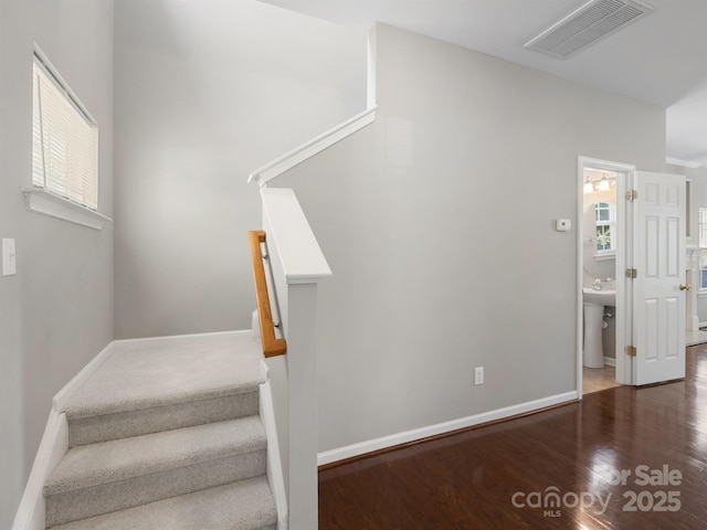 10446 Trolley Run Dr, Cornelius, NC 28031 - stairs with wood finished floors and healthy amount of natural light
