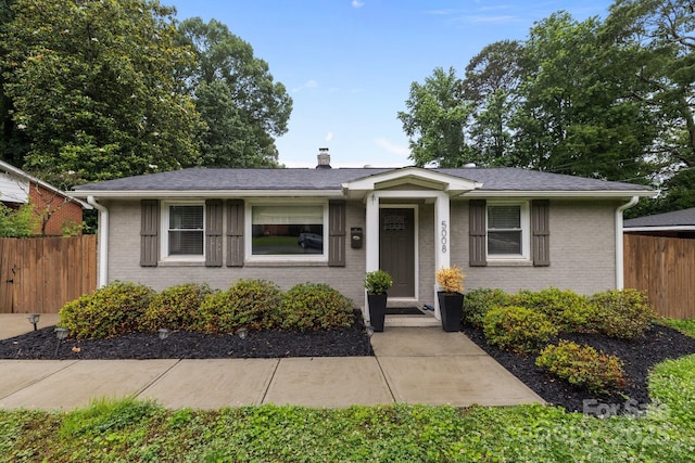 5008 Unaka Ave, Charlotte, NC 28205 - bungalow-style home with brick siding and a chimney