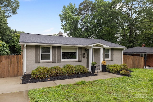 5008 Unaka Ave, Charlotte, NC 28205 - view of front of property with brick siding, a chimney, and a shingled roof