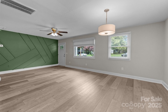 5008 Unaka Ave, Charlotte, NC 28205 - spare room with a ceiling fan and light wood finished floors