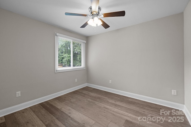 5008 Unaka Ave, Charlotte, NC 28205 - spare room featuring ceiling fan and dark wood-type flooring
