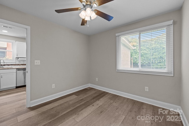 5008 Unaka Ave, Charlotte, NC 28205 - spare room with light wood-type flooring and ceiling fan