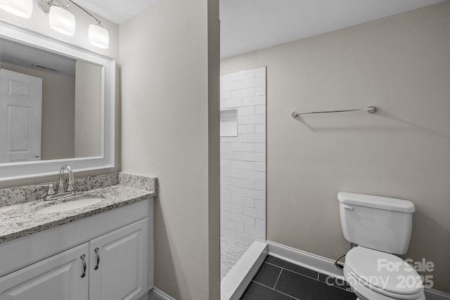 5008 Unaka Ave, Charlotte, NC 28205 - full bathroom featuring vanity, tiled shower, and tile patterned flooring
