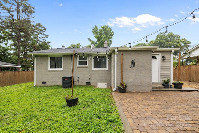 5008 Unaka Ave, Charlotte, NC 28205 - rear view of house featuring crawl space, a patio area, a chimney, and brick siding
