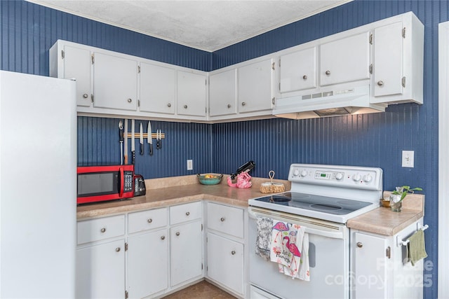 10 Poplar St, Waynesville, NC 28786 - kitchen with white appliances, under cabinet range hood, white cabinetry, and wallpapered walls