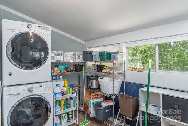 10 Poplar St, Waynesville, NC 28786 - laundry area featuring stacked washer / dryer and ornamental molding