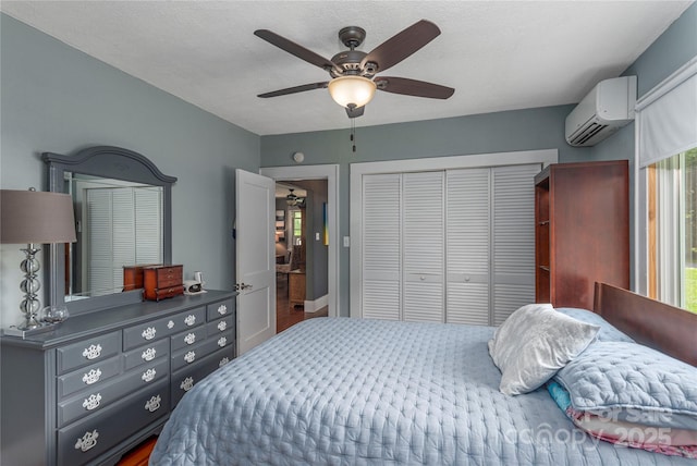 10 Poplar St, Waynesville, NC 28786 - bedroom with a wall unit AC, a closet, and ceiling fan