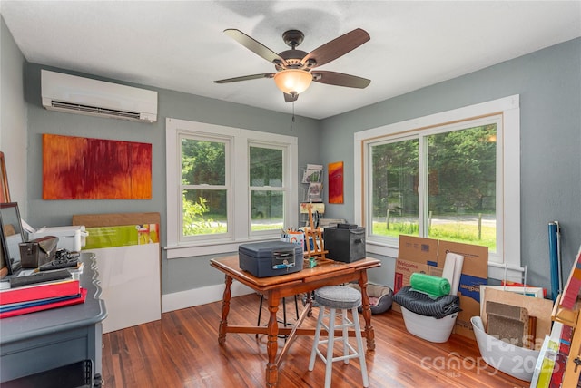 10 Poplar St, Waynesville, NC 28786 - office area with a wall mounted air conditioner, wood finished floors, a ceiling fan, and baseboards