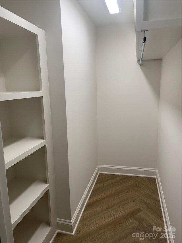 5840 Charing Pl, Charlotte, NC 28211 - walk in closet with dark wood-style floors