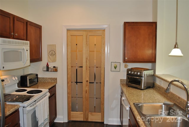 20 Foxden Dr Unit 203, Fletcher, NC 28732 - kitchen with white appliances, a sink, dark wood-style flooring, and decorative light fixtures