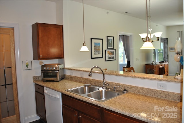 20 Foxden Dr Unit 203, Fletcher, NC 28732 - kitchen with dishwasher, a sink, light countertops, hanging light fixtures, and a peninsula