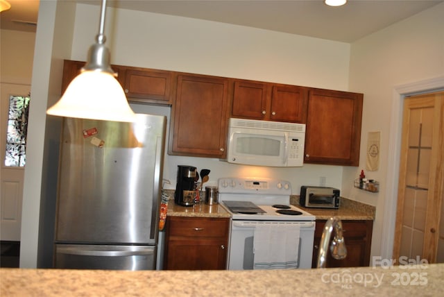 20 Foxden Dr Unit 203, Fletcher, NC 28732 - kitchen with white appliances, light stone counters, and brown cabinetry