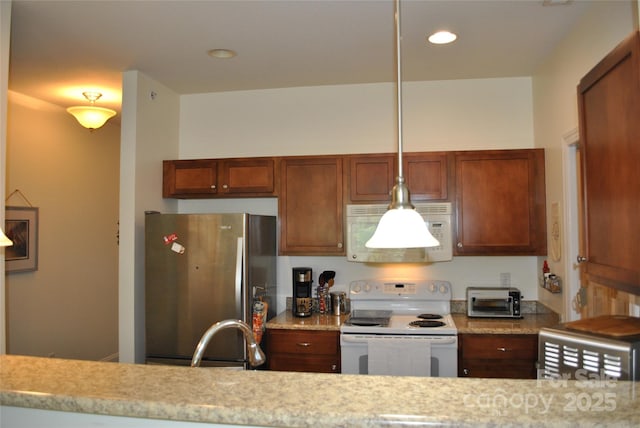 20 Foxden Dr Unit 203, Fletcher, NC 28732 - kitchen with white appliances, a sink, recessed lighting, brown cabinets, and light stone countertops