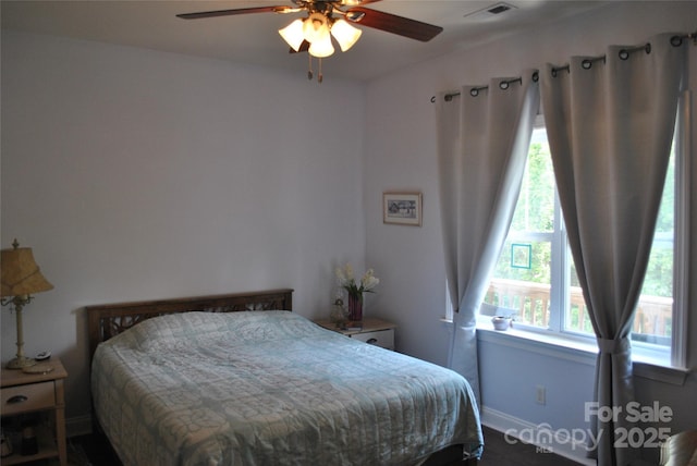 20 Foxden Dr Unit 203, Fletcher, NC 28732 - bedroom featuring multiple windows, baseboards, and ceiling fan