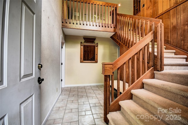 41 Balsam Shadows Rd, Maggie Valley, NC 28751 - entrance foyer with stairs, baseboards, and wooden walls