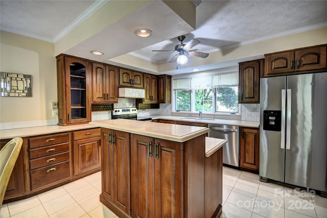 41 Balsam Shadows Rd, Maggie Valley, NC 28751 - kitchen featuring stainless steel appliances, under cabinet range hood, light tile patterned flooring, a ceiling fan, and crown molding