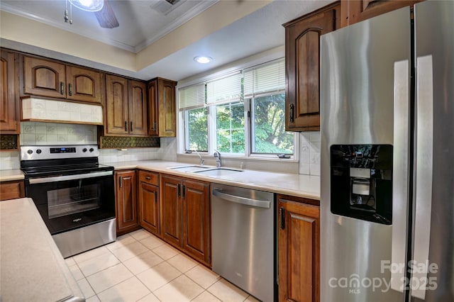 41 Balsam Shadows Rd, Maggie Valley, NC 28751 - kitchen featuring appliances with stainless steel finishes, a sink, crown molding, light countertops, and backsplash