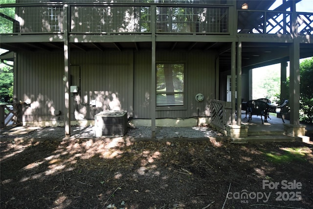 41 Balsam Shadows Rd, Maggie Valley, NC 28751 - back of house with central AC, a balcony, and a patio area