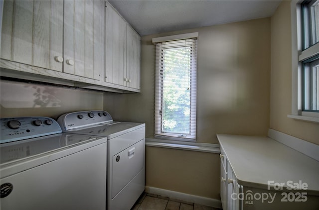 41 Balsam Shadows Rd, Maggie Valley, NC 28751 - washroom featuring cabinet space, separate washer and dryer, baseboards, and light tile patterned floors
