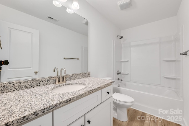 81 Kirk St, Salisbury, NC 28144 - full bathroom featuring vanity, wood finished floors, shower / bathtub combination, and toilet