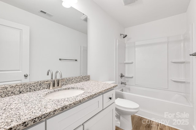 81 Kirk St, Salisbury, NC 28144 - bathroom with wood finished floors, vanity, bathtub / shower combination, and toilet