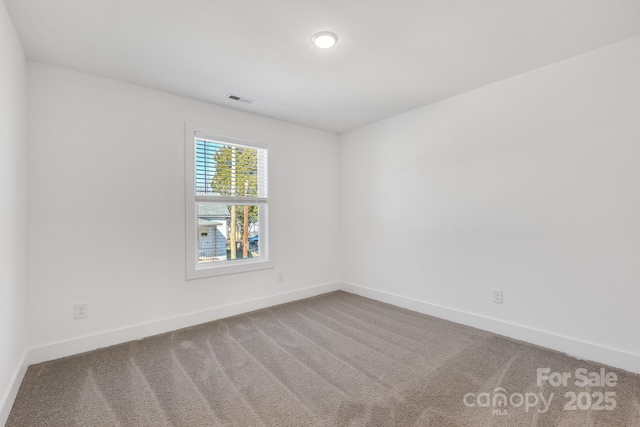 81 Kirk St, Salisbury, NC 28144 - spare room featuring carpet flooring and baseboards