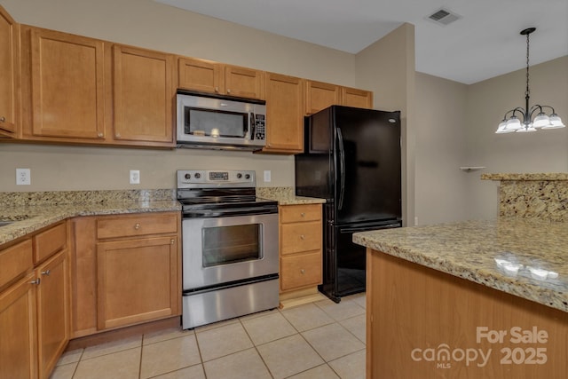 234 Brickton Village Cir Unit 201, Fletcher, NC 28732 - kitchen with appliances with stainless steel finishes, light tile patterned flooring, and light stone counters