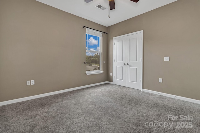 234 Brickton Village Cir Unit 201, Fletcher, NC 28732 - unfurnished bedroom with carpet, a closet, and a ceiling fan