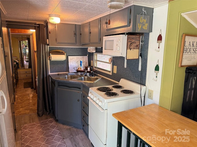 104 Deer Park Rd Unit D143, Mount Gilead, NC 27306 - kitchen featuring white appliances, a sink, and gray cabinets
