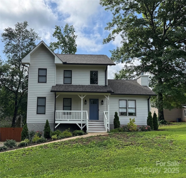 1256 Canseco Ln, Hickory, NC 28602 - view of front of house featuring a porch, a front yard, a chimney, and a shingled roof
