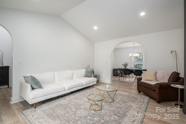 1256 Canseco Ln, Hickory, NC 28602 - living area with arched walkways, light wood-type flooring, a chandelier, recessed lighting, and high vaulted ceiling