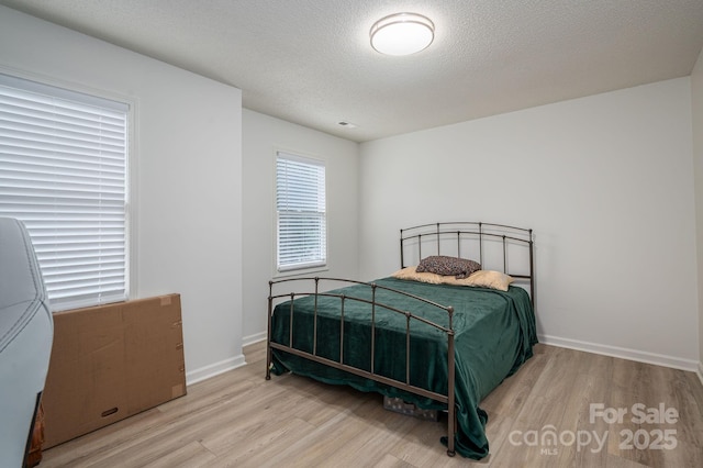 1256 Canseco Ln, Hickory, NC 28602 - bedroom with wood finished floors and a textured ceiling