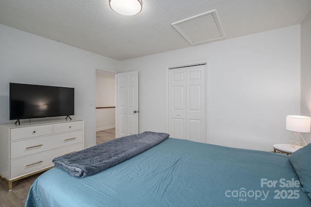 1256 Canseco Ln, Hickory, NC 28602 - bedroom featuring wood finished floors, attic access, and a closet