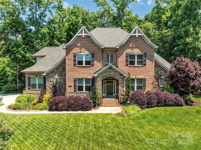 1600 Buckland Ct, Indian Land, SC 29707 - view of front facade featuring stone siding, roof with shingles, a front lawn, and brick siding