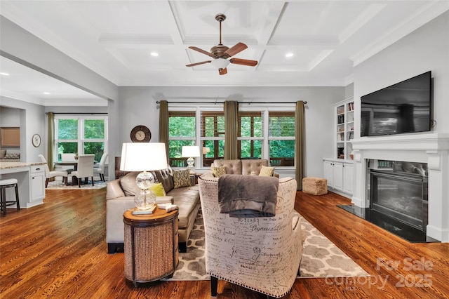 1600 Buckland Ct, Indian Land, SC 29707 - living room featuring a ceiling fan, crown molding, wood finished floors, a fireplace with flush hearth, and beam ceiling