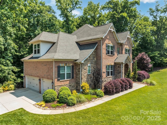 1600 Buckland Ct, Indian Land, SC 29707 - view of front facade featuring stone siding, concrete driveway, a shingled roof, a front yard, and a garage
