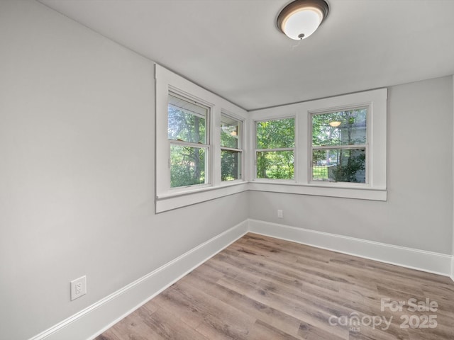 144 Walnut St, Chester, SC 29706 - spare room with plenty of natural light and wood finished floors