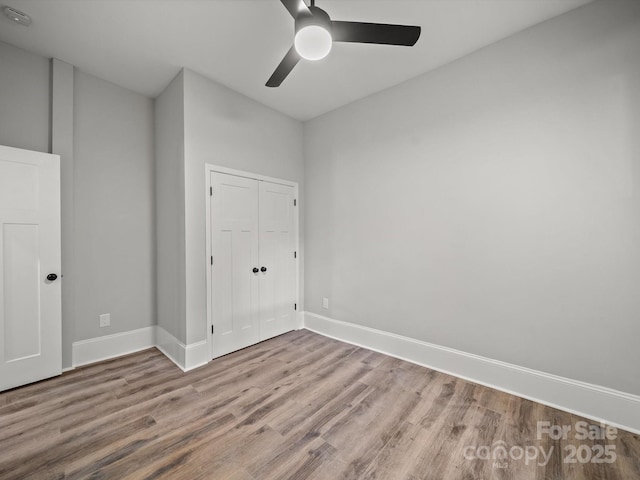 144 Walnut St, Chester, SC 29706 - unfurnished bedroom with wood finished floors, a closet, and ceiling fan