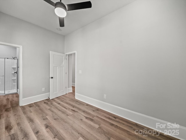 144 Walnut St, Chester, SC 29706 - unfurnished bedroom with wood finished floors, ceiling fan, and ensuite bath