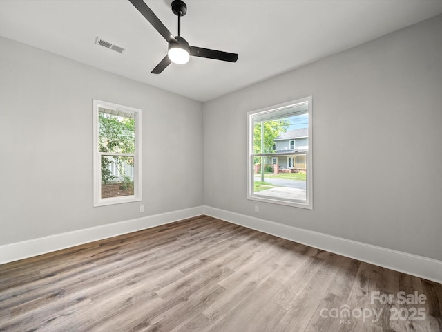 144 Walnut St, Chester, SC 29706 - unfurnished room with healthy amount of natural light, light wood-style floors, and ceiling fan