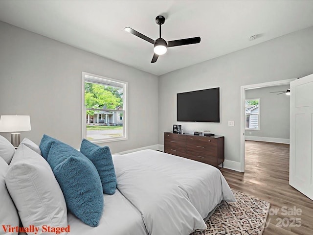 144 Walnut St, Chester, SC 29706 - bedroom with wood finished floors and ceiling fan