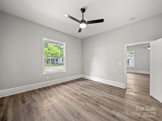 144 Walnut St, Chester, SC 29706 - unfurnished room featuring ceiling fan, healthy amount of natural light, and wood finished floors
