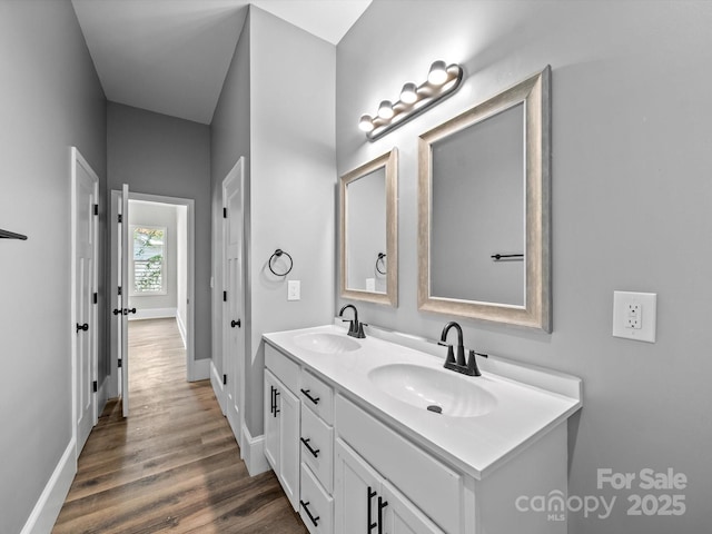 144 Walnut St, Chester, SC 29706 - bathroom with double vanity and wood finished floors
