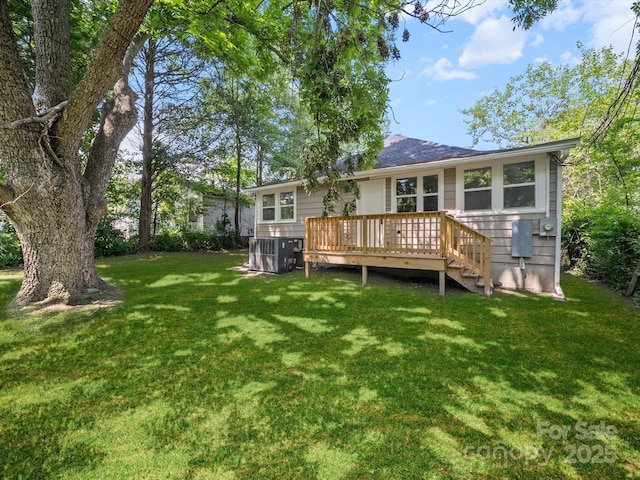 144 Walnut St, Chester, SC 29706 - rear view of house with a wooden deck and a yard