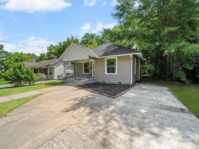 144 Walnut St, Chester, SC 29706 - bungalow-style home featuring a porch, crawl space, a shingled roof, and driveway