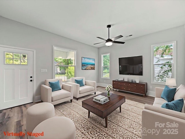 144 Walnut St, Chester, SC 29706 - living area with wood finished floors and a ceiling fan